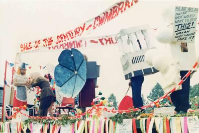 caption popup|It wasn’t all hard work. In 1984 when Cwmbran Development Corporation announced they would be selling off our shopping centre to the private sector Checkpoint volunteers dressed up as town centre landmarks and entered a “Sale of the Century” float in Cwmbran Carnival. We won first prize. (I was the multi-storey car park.)